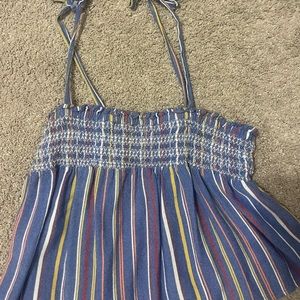 super cute top, adjustable straps to tie